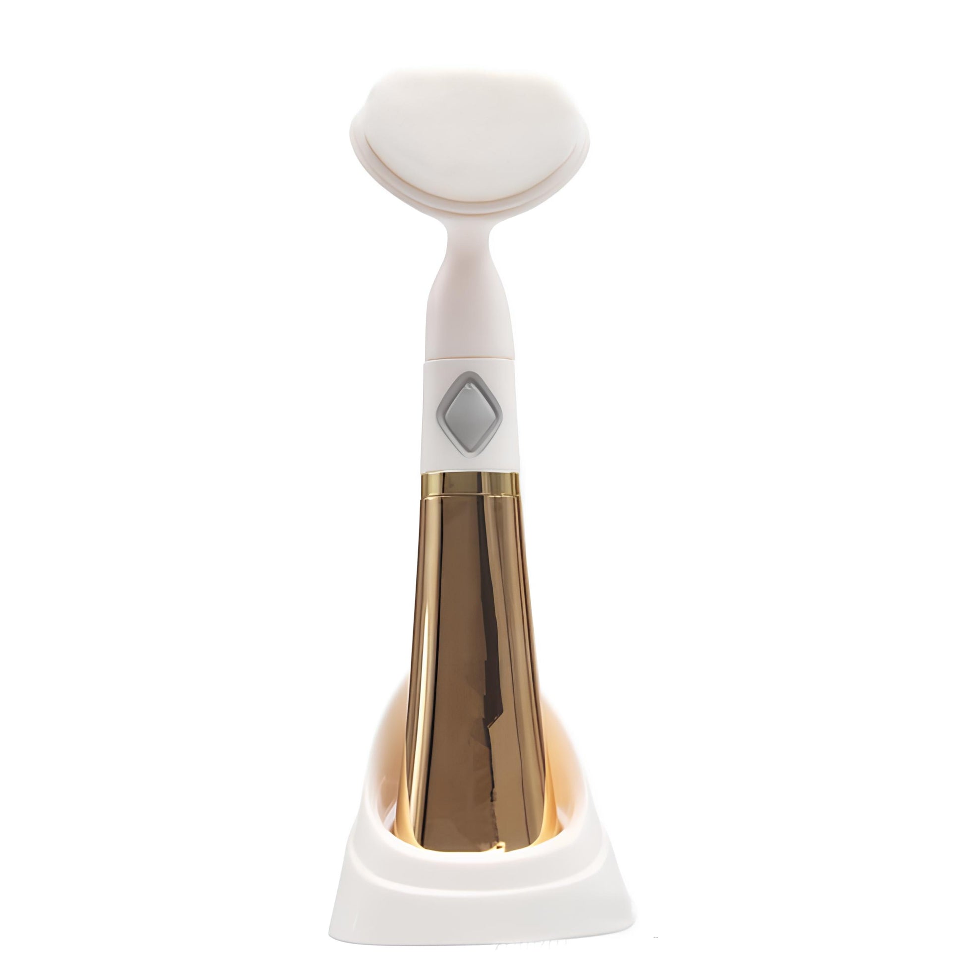 A luxury facial brush with gold accents and soft bristles perfect for gentle exfoliation and removing impurities for a radiant glow. Its compact design makes it ideal for travel.
