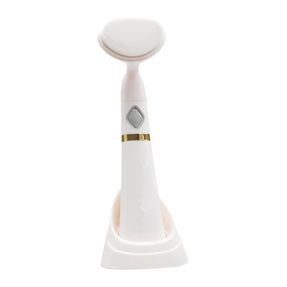Elegant electric face brush with white and gold components, designed to provide a luxurious cleansing experience. Effortlessly removes dirt and makeup, leaving skin feeling smooth and refreshed. Portable size makes it easy to take on-the-go.